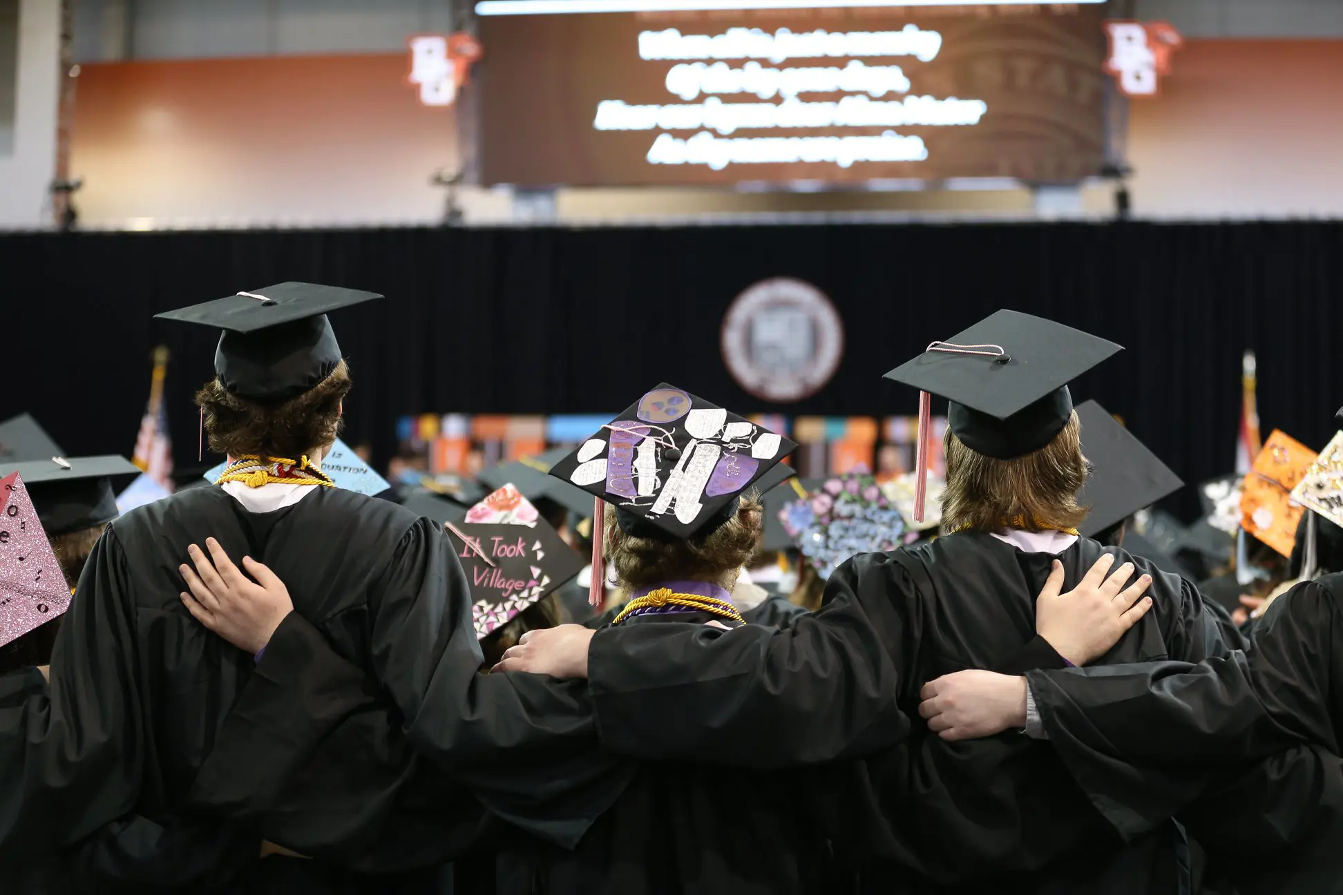 Graduates hugging